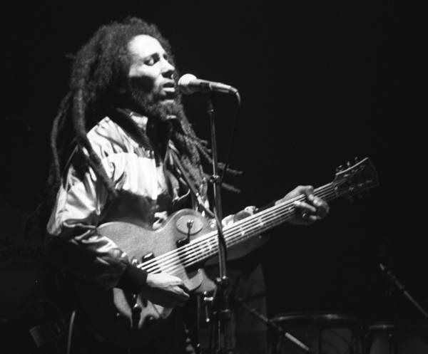 Bob Marley singing on stage with locks flying, Zurich 1980.