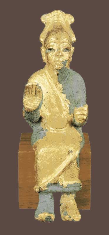 A small bronze seated figure of the god El with one hand raised.