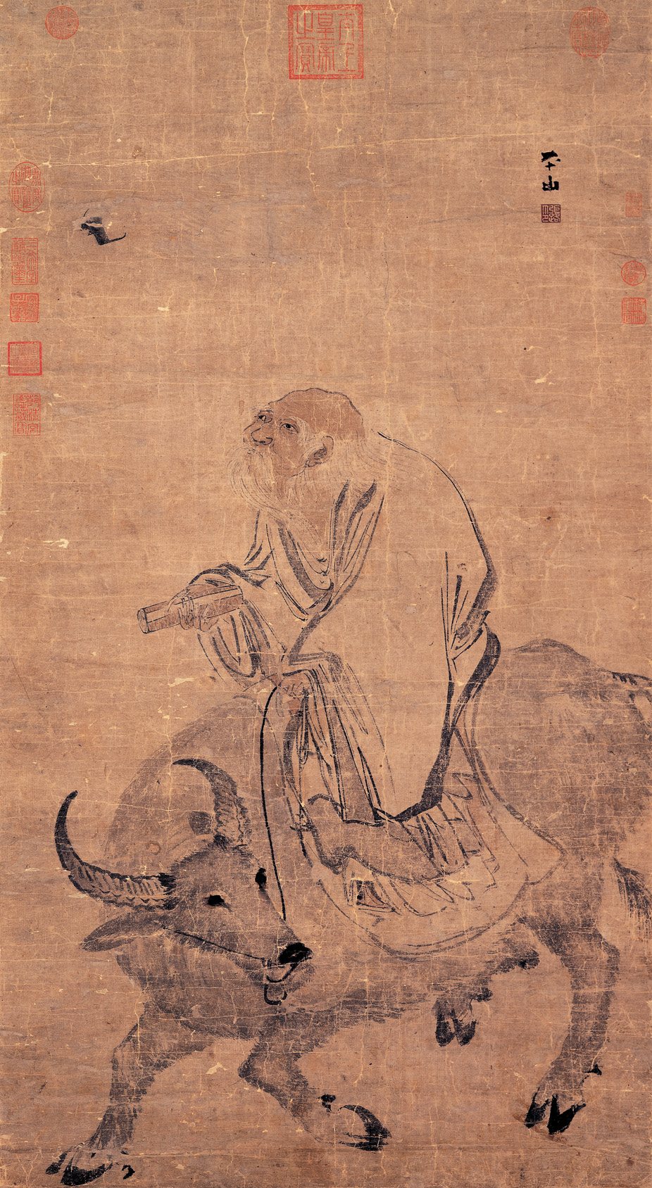 A Ming-dynasty painting by Zhang Lu of Laozi riding a water buffalo, holding a scroll